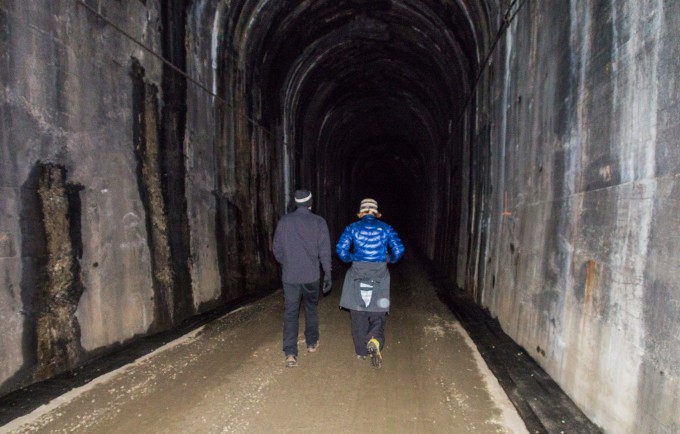 Jason and Stacey walking along the flash illuminated tunnel