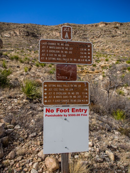 This sign is beyond confusing and makes visitors think they can't walk on the trails...